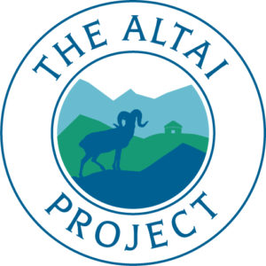 Round blue and green logo contains a wild sheep against mountains and a yurt