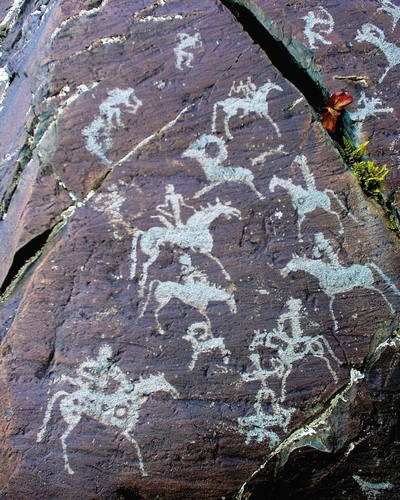 Petroglyphs in Mongolian Altai showing riders on horseback